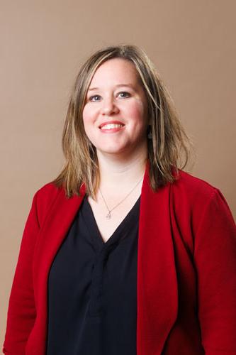 Amanda Seidenzahl wears a professional red blazer and black shirt